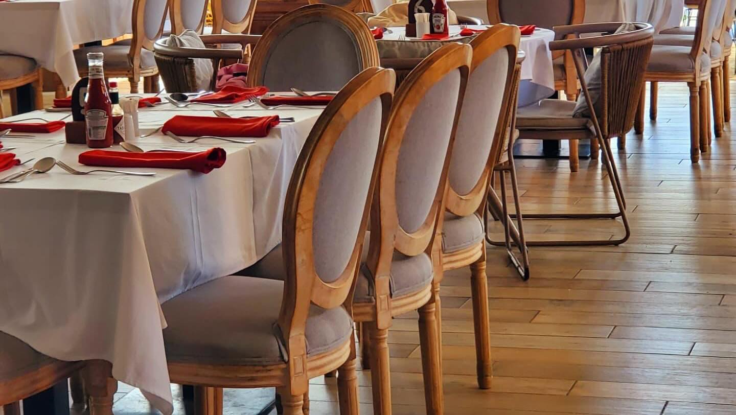 Tables laid with red napkins